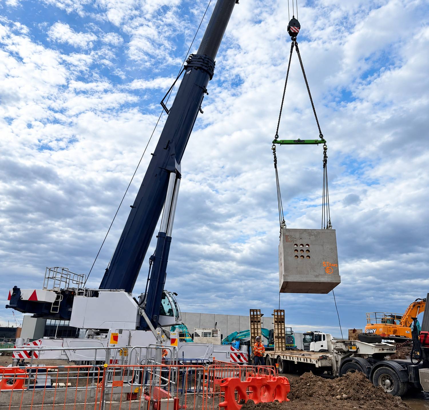 A 240T slew crane lowering a precast pit into position at AWS MEL-081