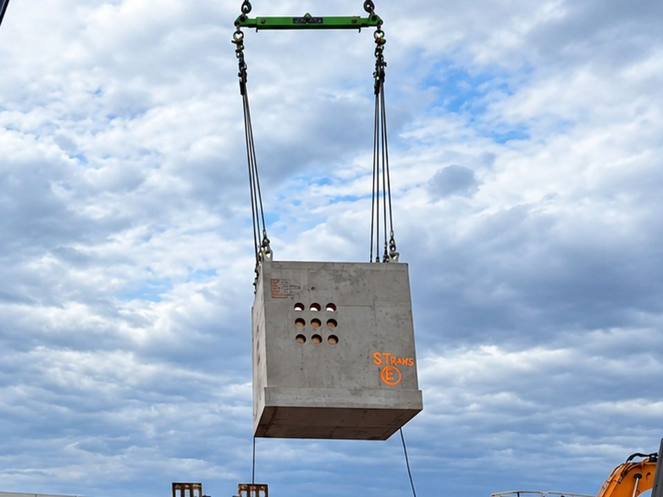 Precast pit in the slings before being set