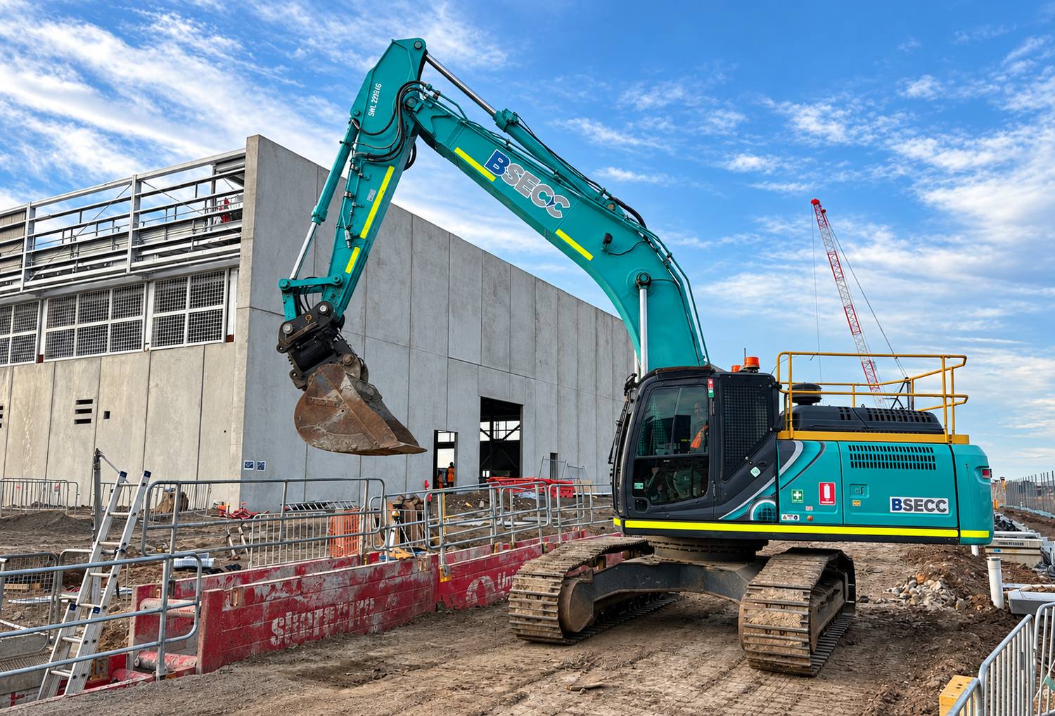 BSECC excavator working alongside a data centre building under construction